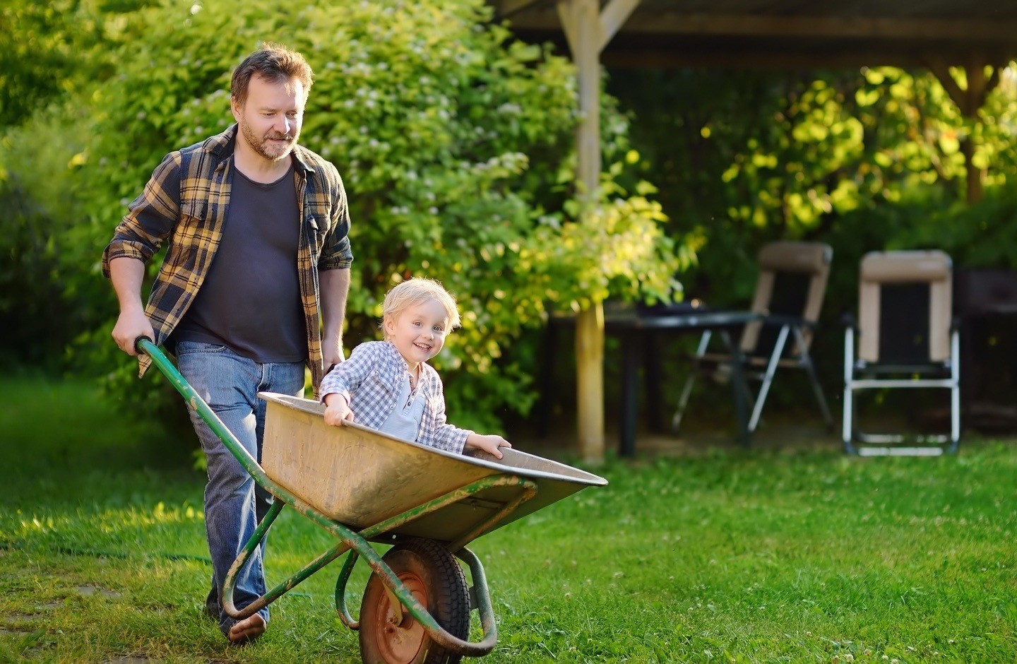 man-with-boy-in-wheelbarrow